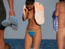 Nudistico.com Two Topless Girls in Blue and Orange Thongs 021.jpg image hosted at ImgAdult.com